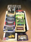 A group of Corgi and other boxed die cast classic cars and delivery vans.