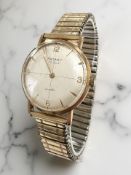 A gent's 9ct gold Rotary wristwatch on plated expanding strap,