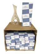 Ten contemporary crystal wine decanters.