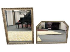 Three bevelled gilt framed mirrors, largest 87 cm x 102 cm.