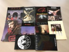 A group of promotional music booklets including Rush, Queen, Rainbow, The Who, White Snake, etc.