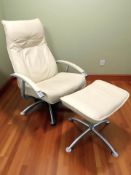 A contemporary cream leather swivel armchair and matching footstool.