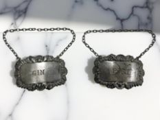A pair of silver decanter labels for Port and Gin, S J Rose & Son, London 1968.