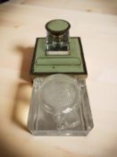 An Art Deco gilt metal and ceramic ink well, and a further glass ink well.
