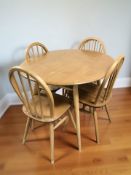 An Ercol light elm and beech oval dining table, 100 cm x 90 cm x 73 cm,
