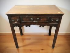 A George III oak three drawer low boy, 75 cm x 45 cm x 71 cm.