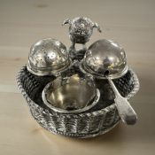 An EPNS egg cruet modelled as a bird's nest by Mappin & Webb.