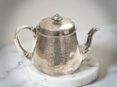 A Victorian silver teapot, London 1879, height 15cm, (handle detached, a/f).