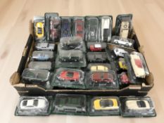 A collection of 1:43 scale die cast model cars in packaging.