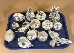 A group of silver plated ornamental fruit.