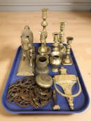 A group of Victorian brass candlesticks, horse brasses, figure of a horse, door knocker, etc.