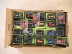A collection of 1:43 scale die cast model tractors and combine harvesters in packaging.