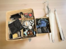 A quantity of photography equipment, camera straps, filters, etc.