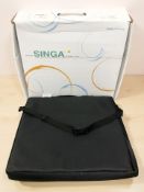 A Singa wheelchair cushion in box.