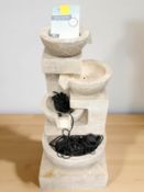 A resin water feature, height 87 cm.