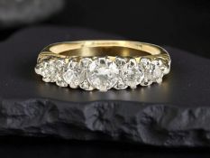 An 18ct five stone diamond ring, approximately 0.7ct, size O CONDITION REPORT: 3.