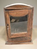A small oak smoker's cabinet, height 26 cm.