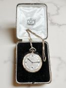 A 9ct gold slim-bodied open face pocket watch retailed by Reids,