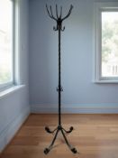 A wrought metal hat and coat stand, height 190 cm.