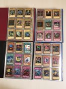 Four Yu-Gi-Oh! trading card albums and contents.
