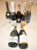 Seven various bottles of alcohol including Aimery, Prosecco, etc.