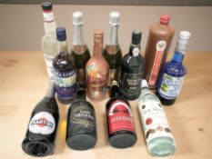 Twelve various bottles of alcohol including Dow's port, Croft Original sherry, Martini, etc.