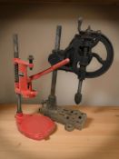 A vintage drill press and a further workbench clamp.