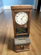 A National Time Recorder Company Limited national electric clocking in and out machine, in oak case,