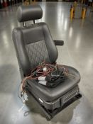 A vehicle assisted access seat for wheelchair users.