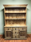 A modern pine dresser, 132 cm x 49 cm x 199 cm.