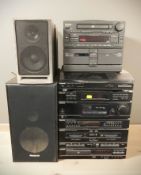 A Panasonic hi-fi and a Pioneer hi-fi with speakers.