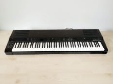 A Yamaha Clavinova PF P-100 digital keyboard.