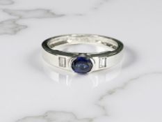 An 18ct white gold sapphire and diamond three stone ring,