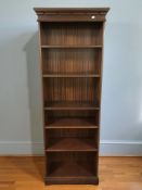 A reproduction mahogany open bookcase, 67 cm x 31 cm x 189 cm.