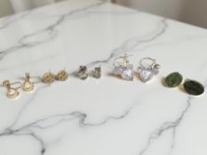 A pair of silver and moonstone earrings, another silver pair,