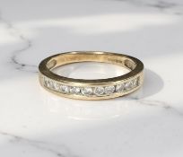 A 9ct gold half-eternity dress ring, size M CONDITION REPORT: 2.