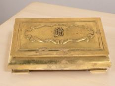 An early 20th century brass cigarette box.