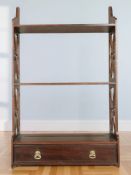 A reproduction mahogany wall shelf, width 41 cm.