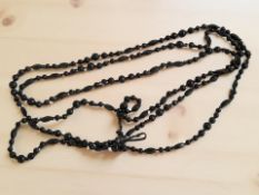 A Whitby jet bead necklace.