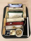 A group of simulated pearl necklaces, gold plated pendants, earrings, other costume items.