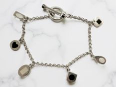 A silver bracelet with mother of pearl and onyx decoration, length 17.5cm.