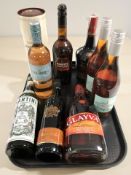 Nine various bottles of alcohol including Harvey's Bristol cream, Glayva, Martini, etc.