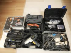 A group of boxed tools including electric wrench, dremel, challenge route and sander, etc.