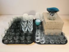 A collection of Scandinavian and other drinking glasses, blue glass bowl, etc.