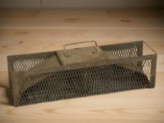 A vintage humane rat trap.