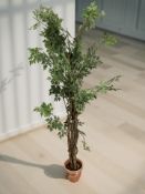 An artificial tree in pot, height 168 cm.