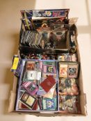 A large quantity of Yu-Gi-Oh! trading cards, key rings, lapel badges, etc.