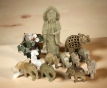 A group of carved soapstone ornaments including figure of Buddha, elephants,