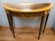 A reproduction mahogany and satinwood demilune hall table in the Georgian style, width 91 cm.