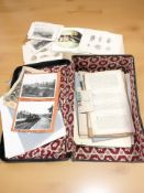 A vintage suitcase containing assorted ephemera, unframed monochrome engravings of Northumberland,